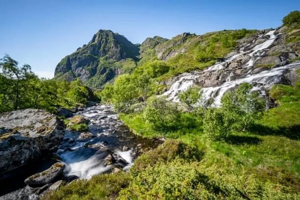 Umelecká fotografie Lofoten waterfall on the hiking trail, imageBROKER/Mara Brandl, (40 x 26.7 cm)