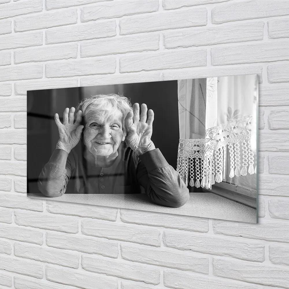 Obraz na skle staršia žena 120x60 cm