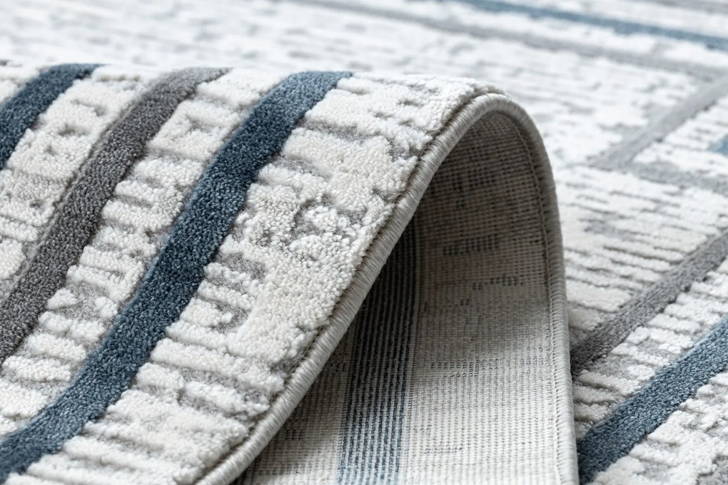 Koberec TULS 51242 s rámikom, slonovinová modrá