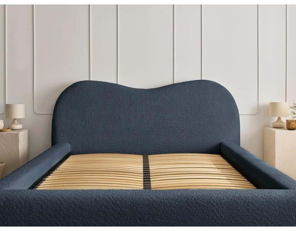 Tmavomodrá čalúnená dvojlôžková posteľ s úložným priestorom s roštom 180x200 cm Orlane – Bobochic Paris