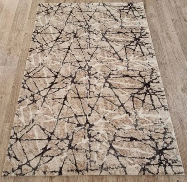 Béžový huňatý koberec Plush Deluxe – mramorový vzor Rozmer: 50x80 cm