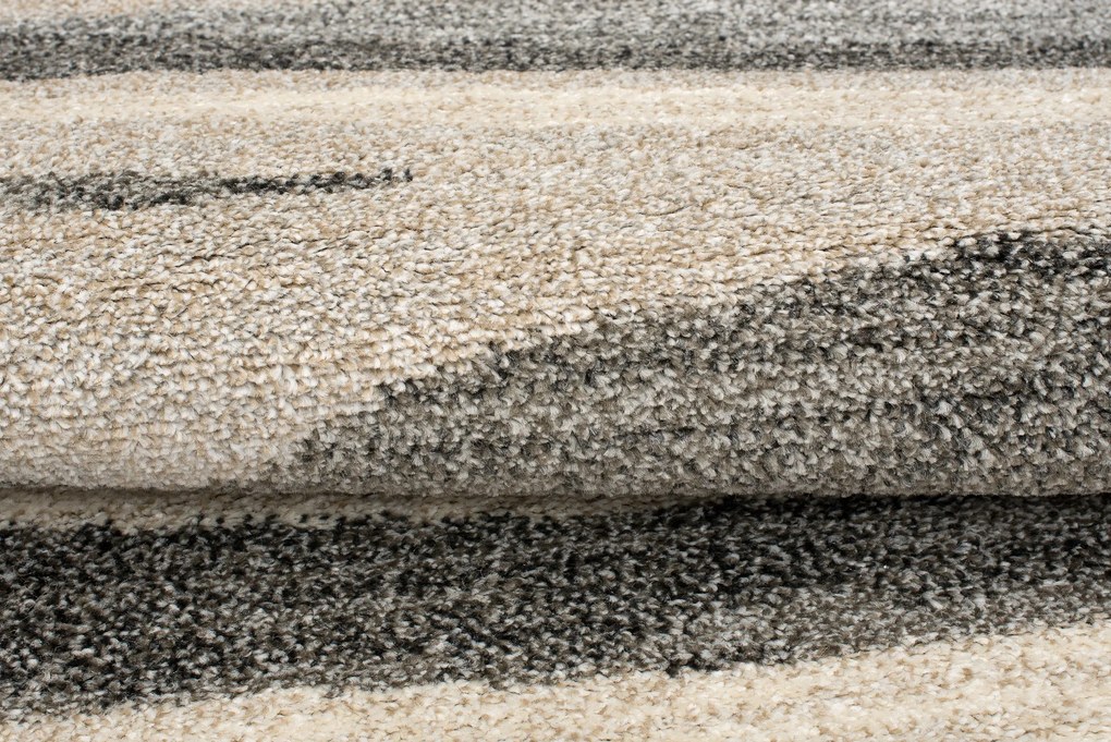 TA Koberec K186A STREDNÉ SIVÉ SARI KOLESO B1X Rozmer: 130x130 cm