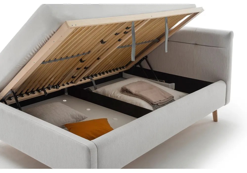 Svetlosivá čalúnená dvojlôžková posteľ s úložným priestorom s roštom 140x200 cm Lotte – Meise Möbel