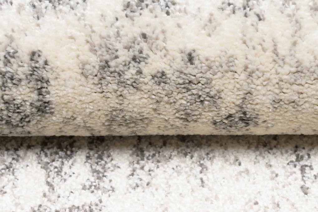 Krémový dizajnový koberec so svetlým sivým vzorom