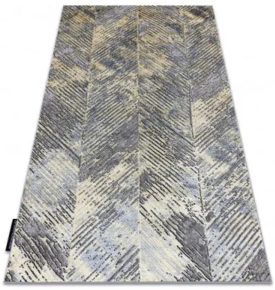 Koberec DE LUXE 2087 Jodelka Chevron vintage - zlatý / sivý