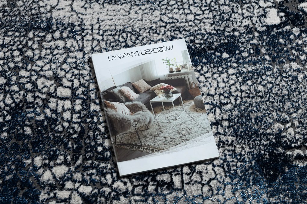 Moderný koberec DE LUXE 528 Abstrakcia - Štrukturálny krém / tmavomodrý