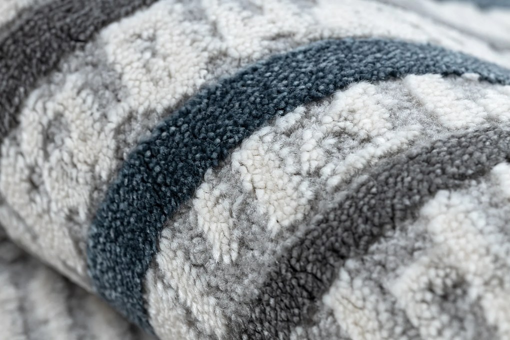 Koberec TULS 51242 s rámikom, slonovinová modrá