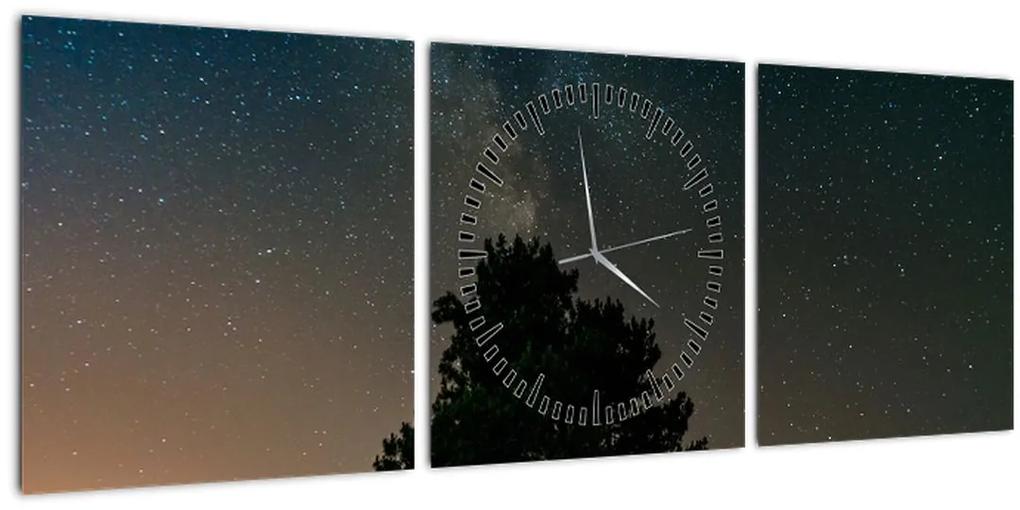 Obraz nočnej oblohy so stromami (s hodinami) (90x30 cm)