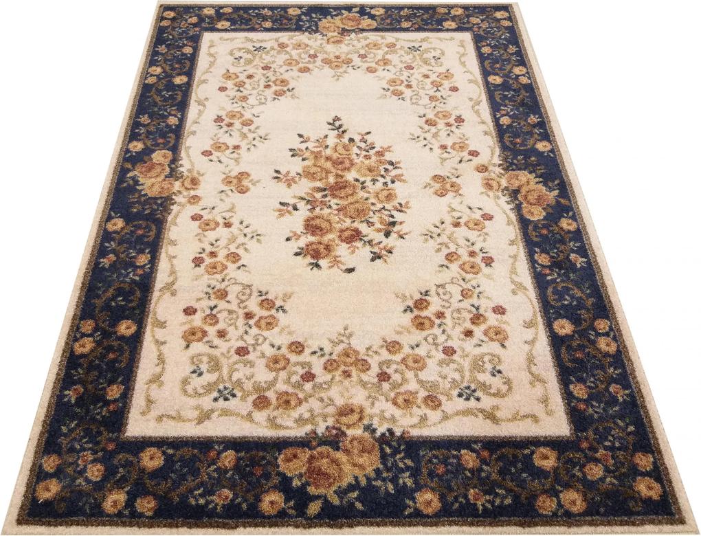 Kvalitný krémovo modrý koberec s motívom kvetov