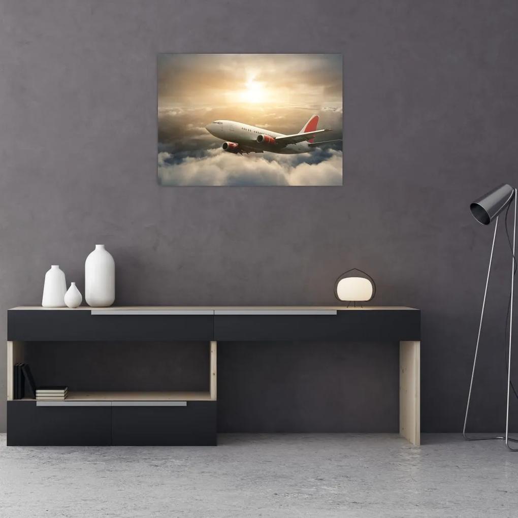 Sklenený obraz - Lietadlo v oblakoch (70x50 cm)