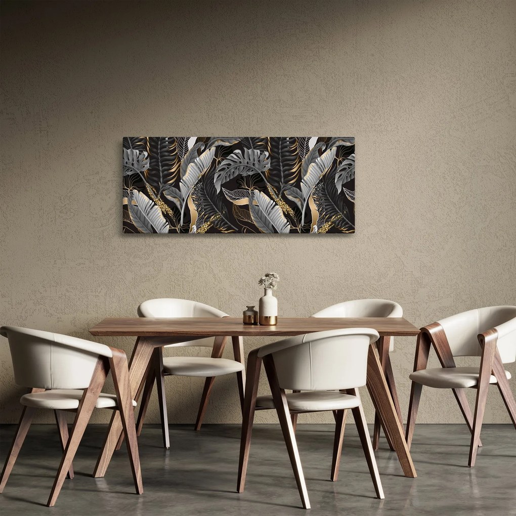 Obraz - Tropické listy v čierno-zlatej (120x50 cm)
