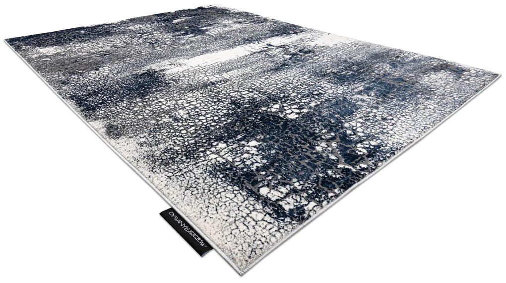 Moderný koberec DE LUXE 528 Abstrakcia - Štrukturálny krém / tmavomodrý