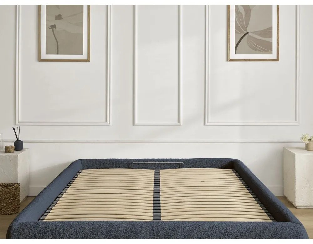 Tmavomodrá čalúnená dvojlôžková posteľ s úložným priestorom/bez čela s roštom 180x200 cm Inera – Bobochic Paris