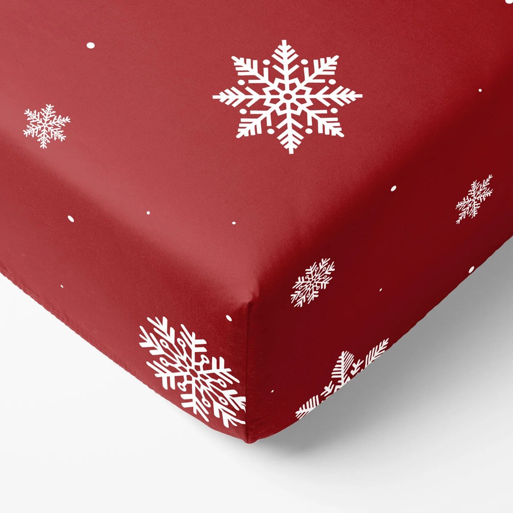 Goldea bavlnená napínacia plachta - snehové vločky na červenej 90 x 200 cm