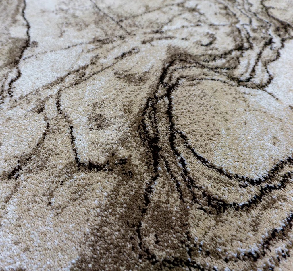 Koberec Wenus 7770 béžový – obdĺžnikový s abstraktným vzorom Rozmer: 120x180 cm
