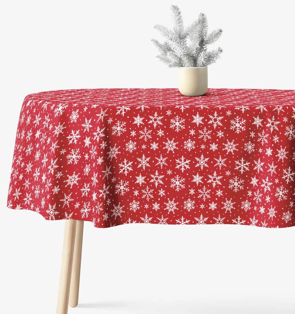 Goldea vianočný oválny obrus valencia - biele vločky na červenej 140 x 220 cm