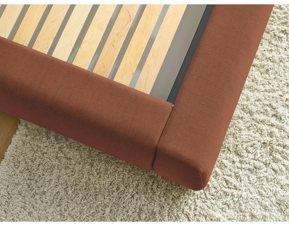 Oranžová čalúnená dvojlôžková posteľ s úložným priestorom s roštom 180x200 cm Jagna – Bobochic Paris