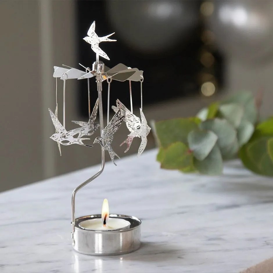 Pluto Design Rotujúci svietnik Swallow Silver