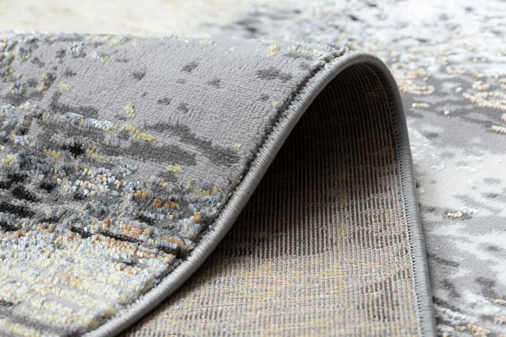 Moderný koberec DE LUXE 633 Abstrakcia - Štrukturálny krém / zlatý