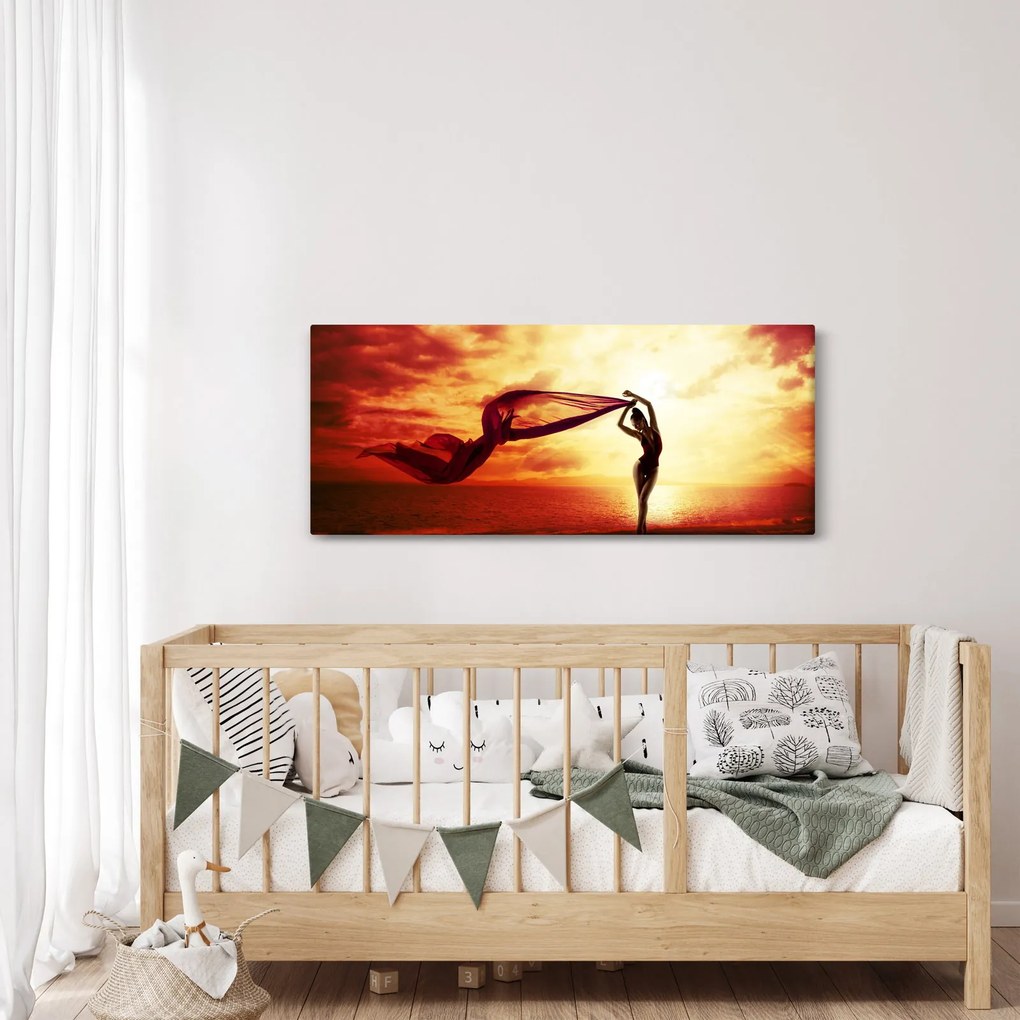 Obraz - Silueta ženy v západu slnka (120x50 cm)