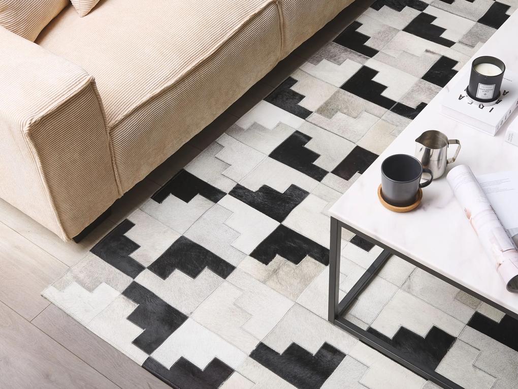 Kožený koberec 140 x 200 cm sivá/čierna EFIRLI Beliani