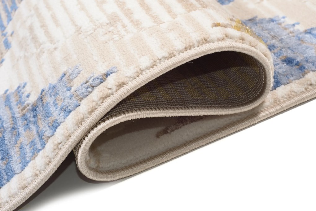 TA Koberec D654M BIELA/TMAVOMODRÁ ASTHANE Rozmer: 180x250 cm