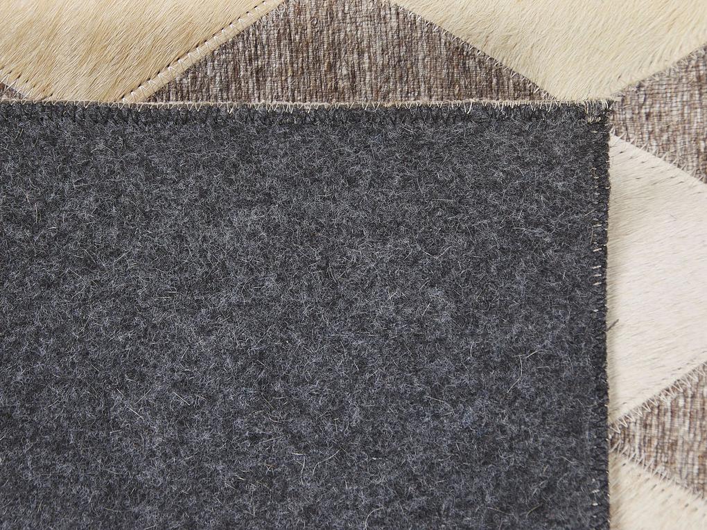 Kožený koberec 160 x 230 cm béžová/hnedá SESLICE Beliani