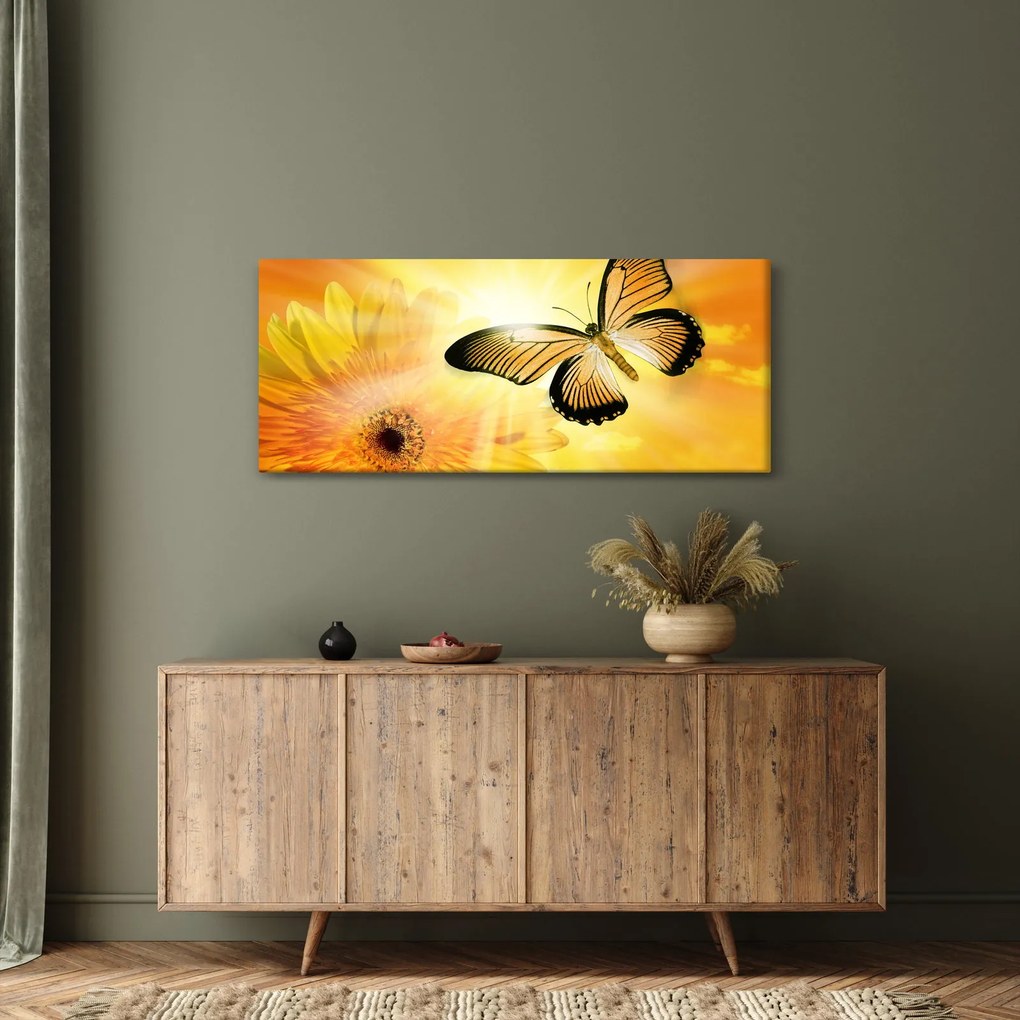 Obraz - Žltý motýľ s kvetom (120x50 cm)