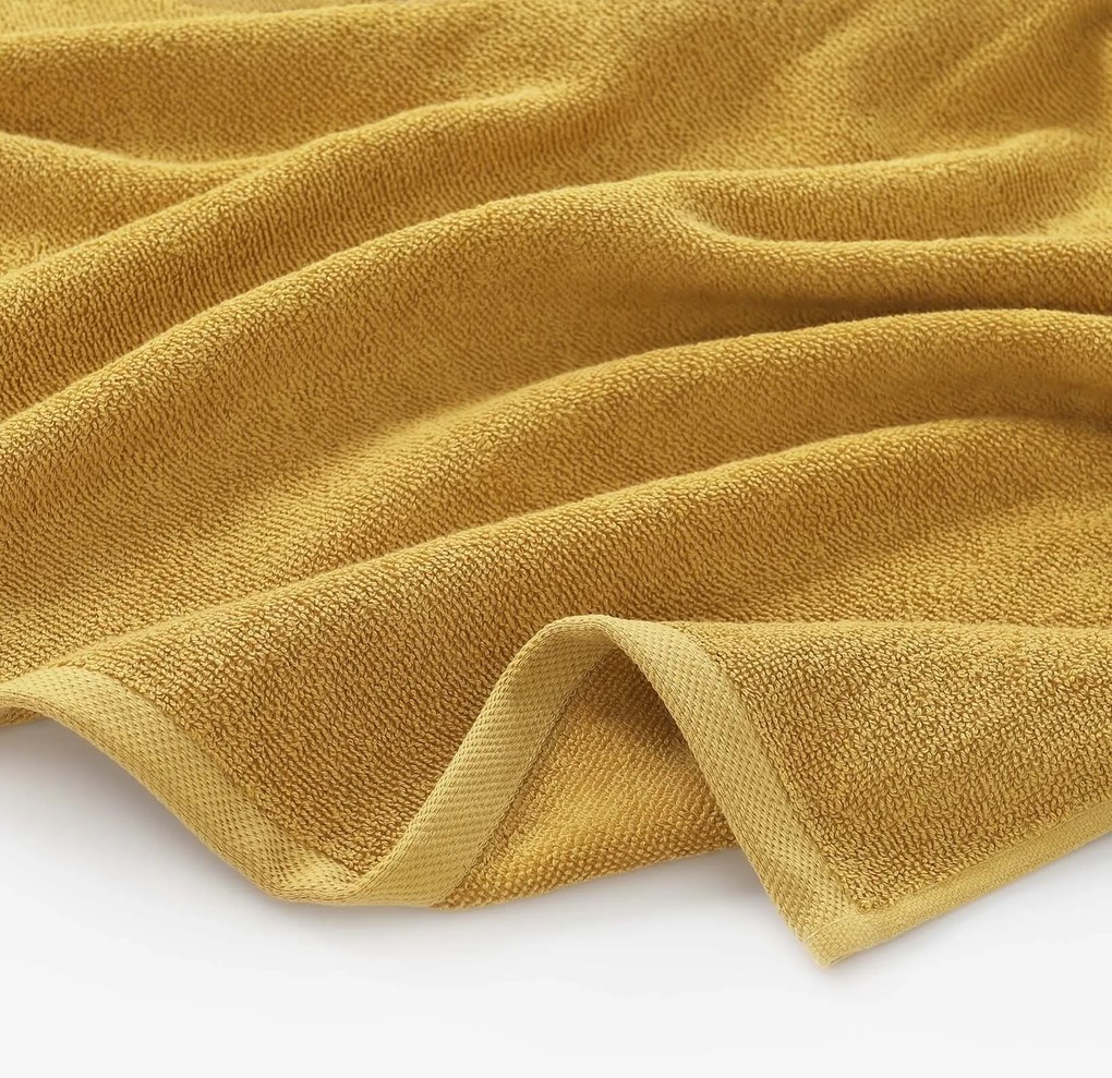 Goldea bavlnený froté uterák / osuška soft bez bordúry – horčicový 30 x 50 cm