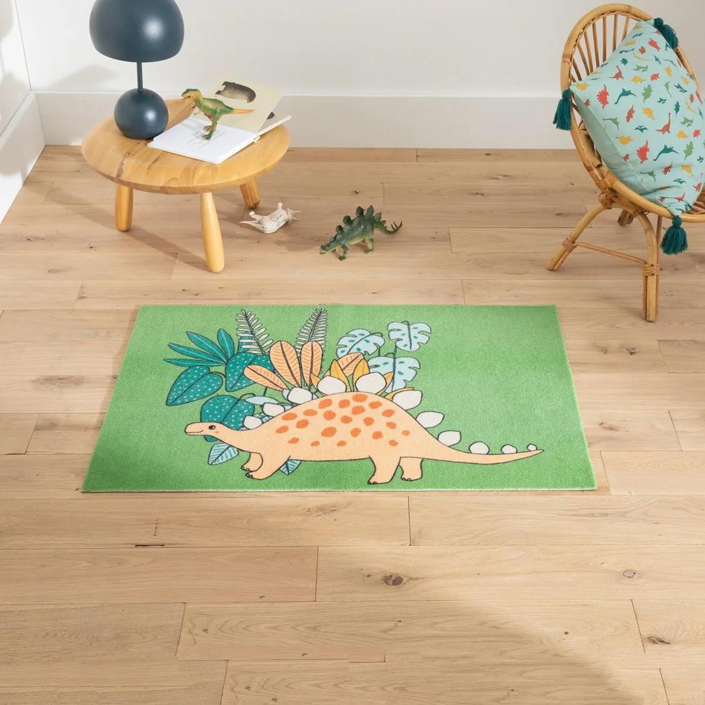 Protišmykový koberec v tvare dinosaura Cca 60 x 90 cm.