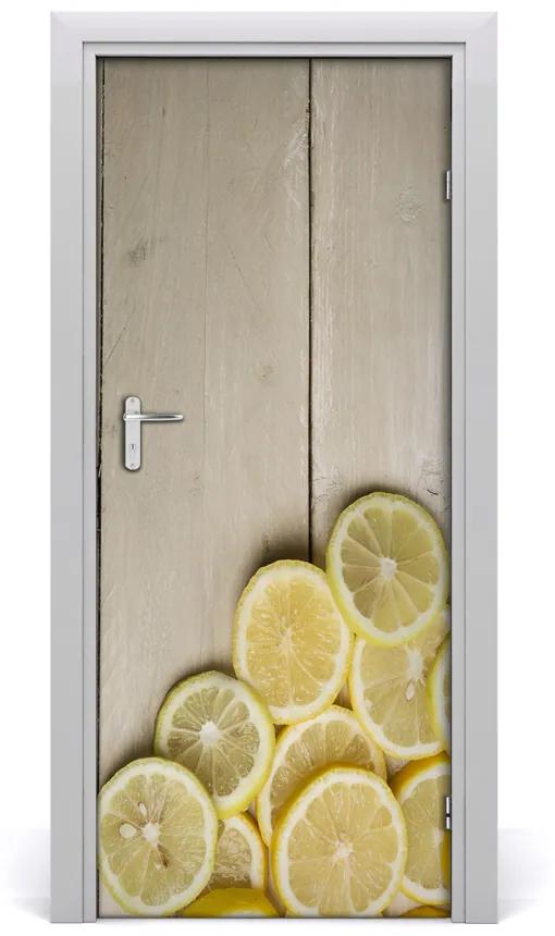 Fototapeta na dvere samolepiace citróny na dreve 75x205 cm