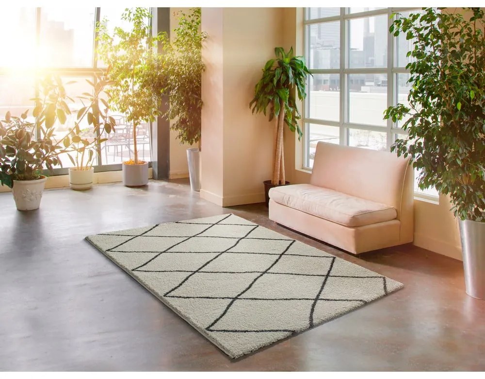 Biely koberec Universal Atlas Geo, 133 x 190 cm