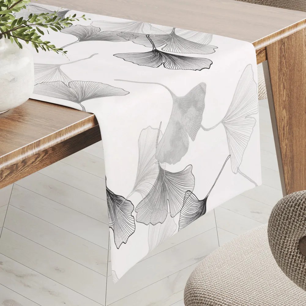 Biante Bavlnený behúň na stôl Sandra SA-512 Sivo-biele ginkgo listy na bielom 20x120 cm