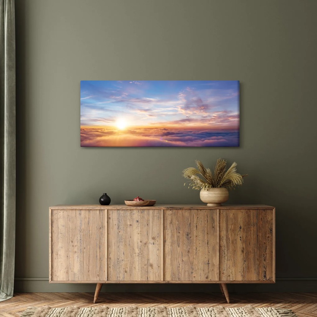 Obraz - Západ slnka nad mrakmi (120x50 cm)
