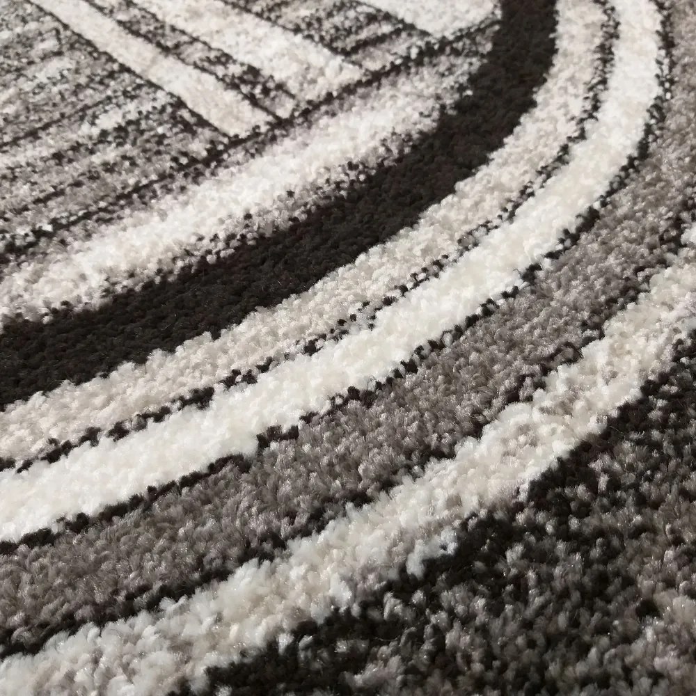 Originálny sivo hnedý koberec s motívom abstraktných kruhov Šírka: 80 cm | Dĺžka: 150 cm