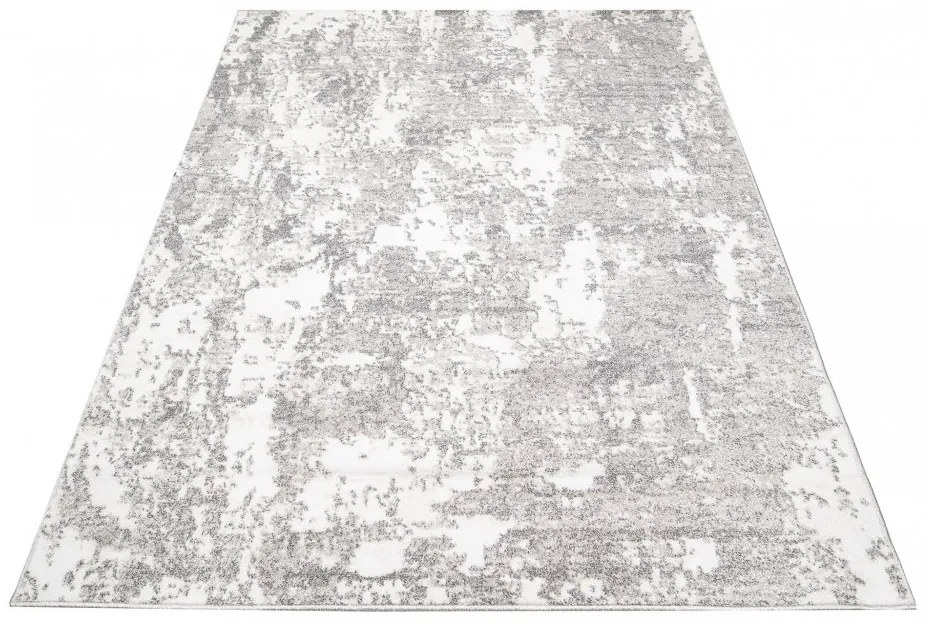 Dizajnový koberec s abstraktným vzorom v krémovej farbe Šírka: 80 cm | Dĺžka: 150 cm