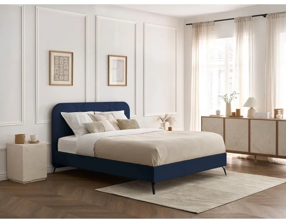 Tmavomodrá čalúnená dvojlôžková posteľ s roštom 180x200 cm Prune – Bobochic Paris