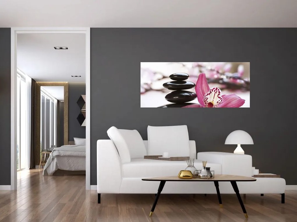 Obraz masážnych kameňov a orchidey na vode (120x50 cm)