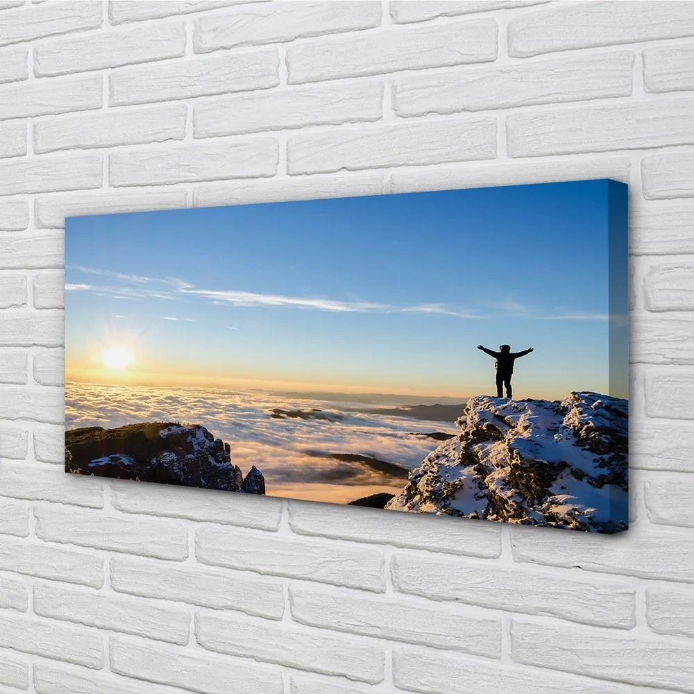 Obraz canvas Mountain muž mraky východ 120x60 cm