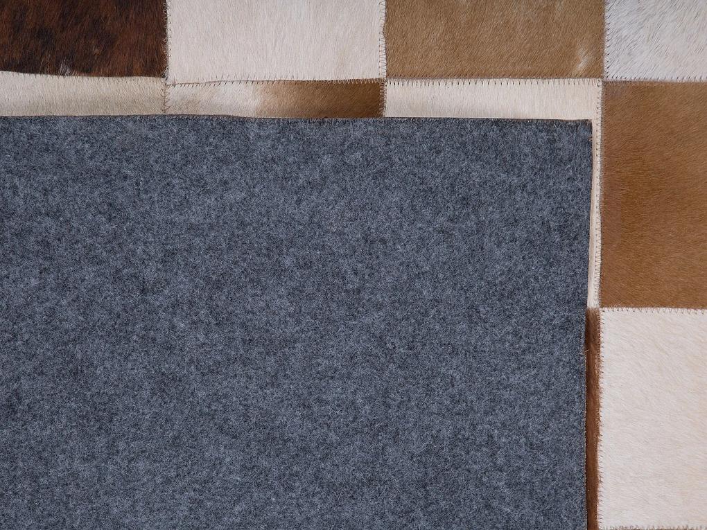 Kožený koberec 160 x 230 cm hnedá/béžová SOLMAZ Beliani