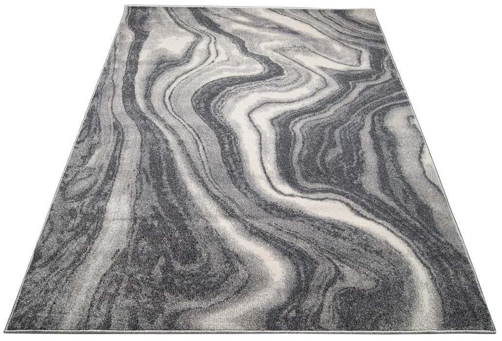 Tmavý sivý dizajnový koberec s abstraktným vzorom