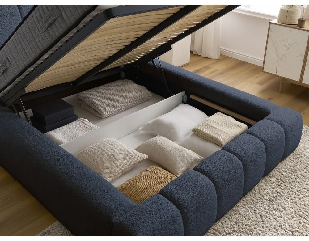 Tmavomodrá čalúnená dvojlôžková posteľ s úložným priestorom s roštom 180x200 cm Denali – Bobochic Paris