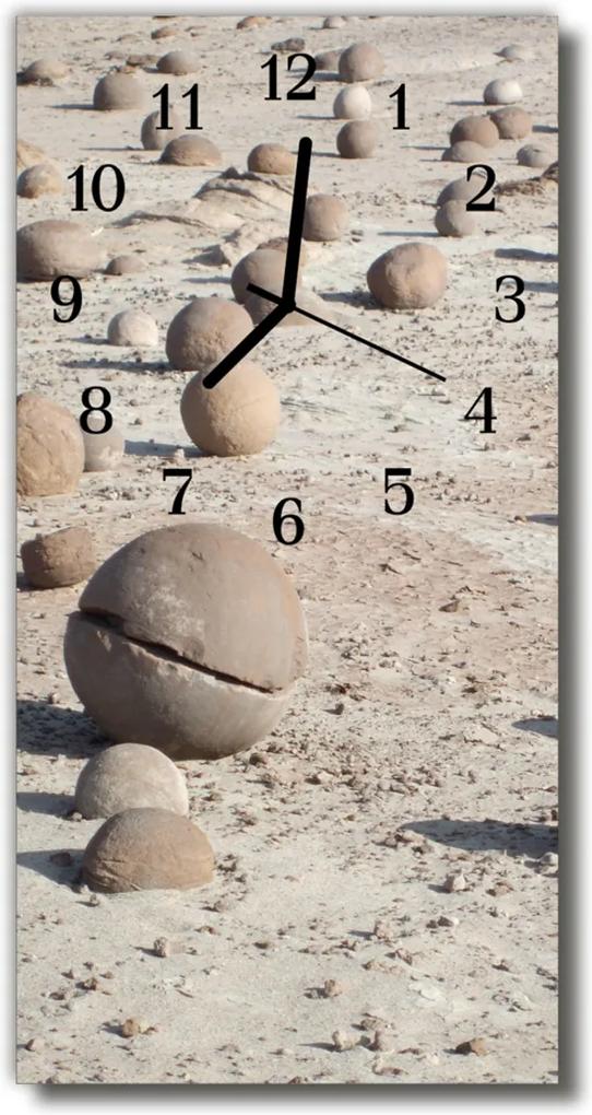 Sklenené hodiny vertikálne  Zobraziť kamene na béžovej pláži
