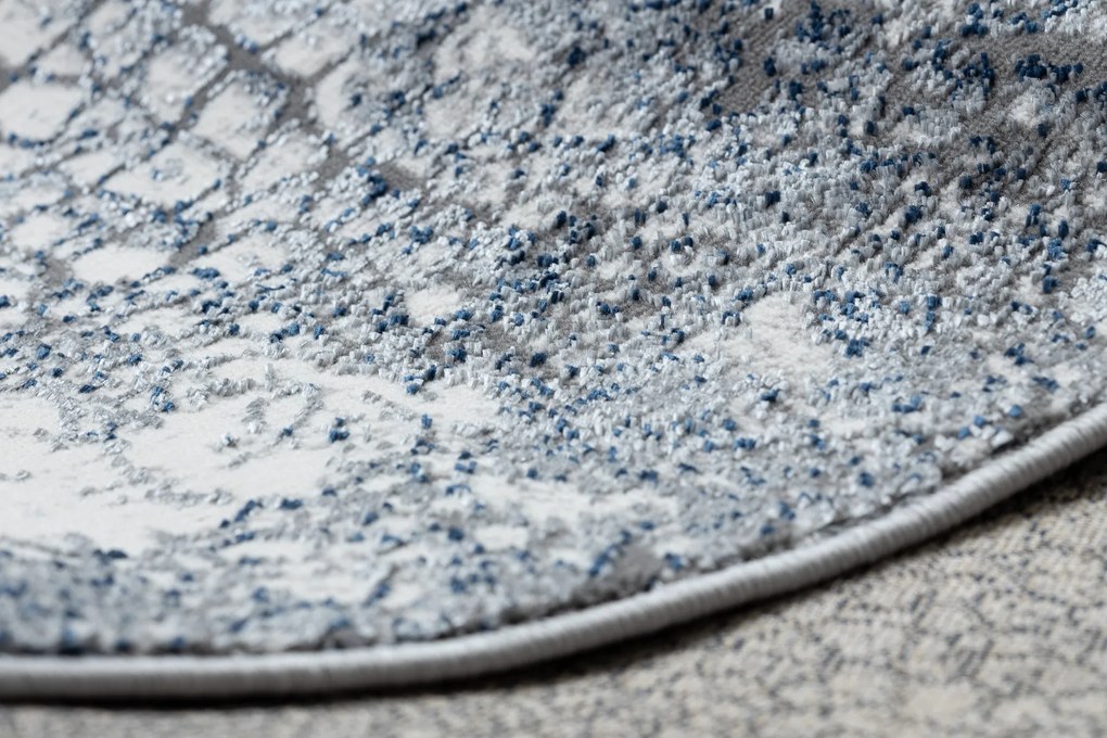 Moderný koberec DE LUXE 528 Abstrakcia - Štrukturálny krém / tmavomodrý