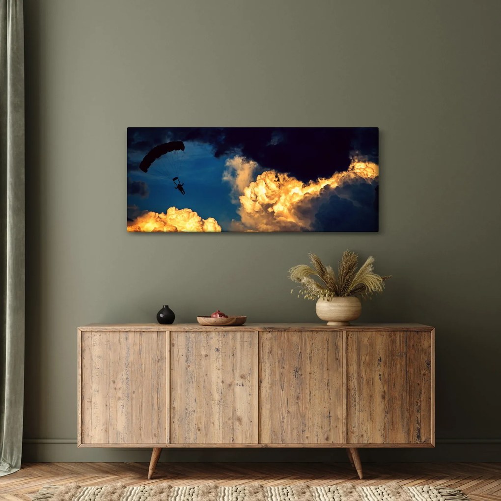 Obraz parašutistu v oblakoch (120x50 cm)
