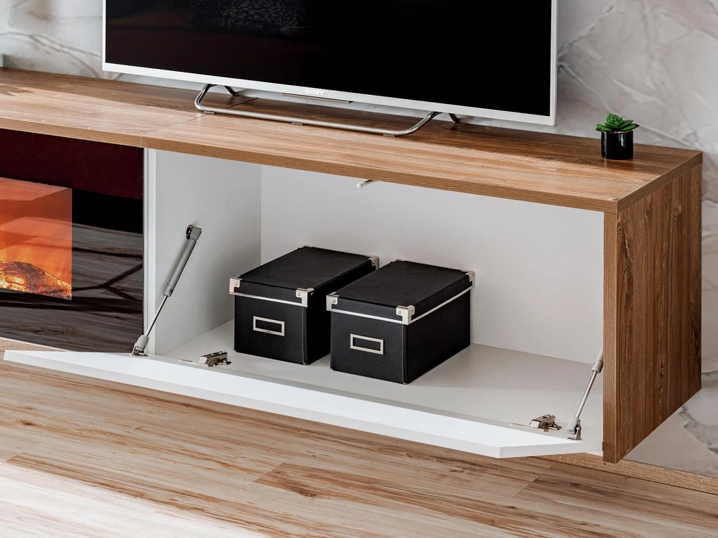 Tv stolík/skrinka Dalton (dub sterling + biela matná) (s elektrickým krbom). Akcia -19%. Vlastná spoľahlivá doprava až k Vám domov. 1097691