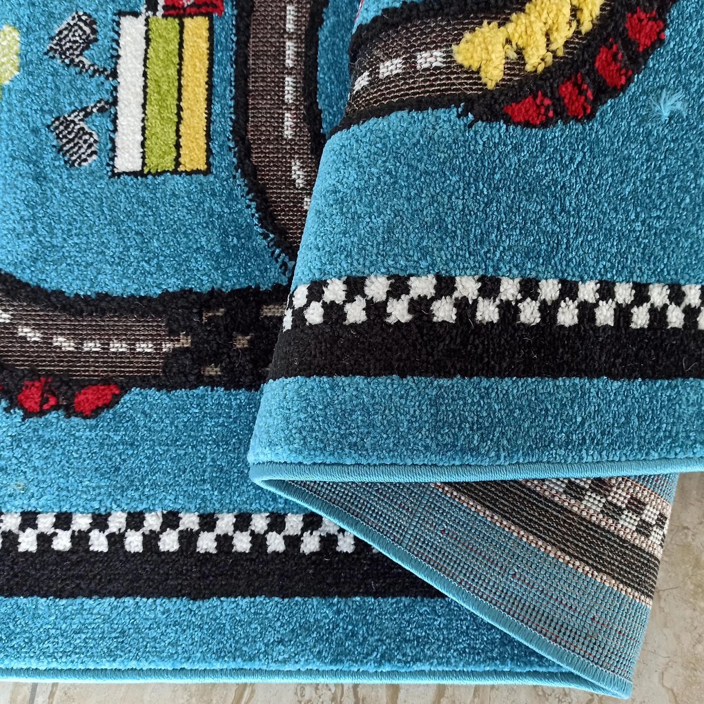 DY Detský modrý koberec s motívom autodráhy Color Kids 04 Rozmer: 150x200 cm