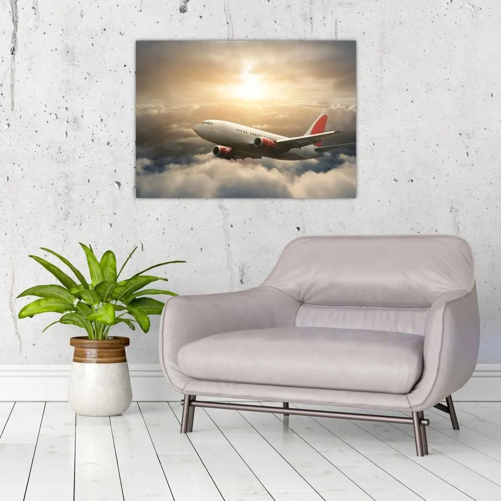 Sklenený obraz - Lietadlo v oblakoch (70x50 cm)