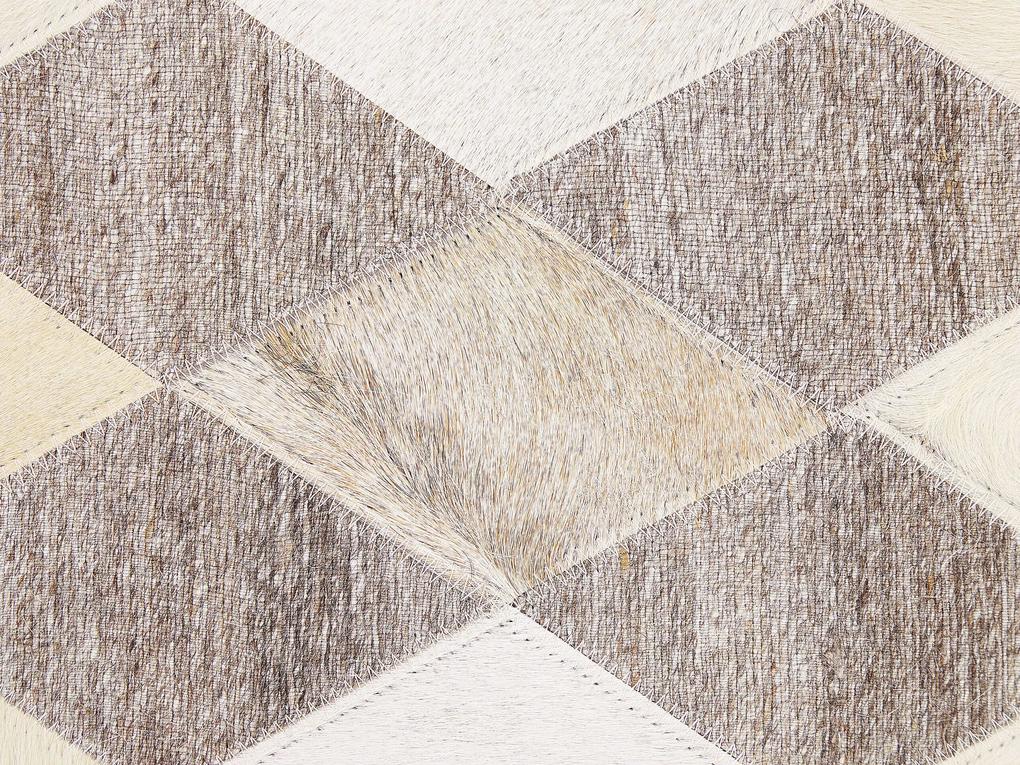 Kožený koberec 140 x 200 cm béžová/hnedá SESLICE Beliani