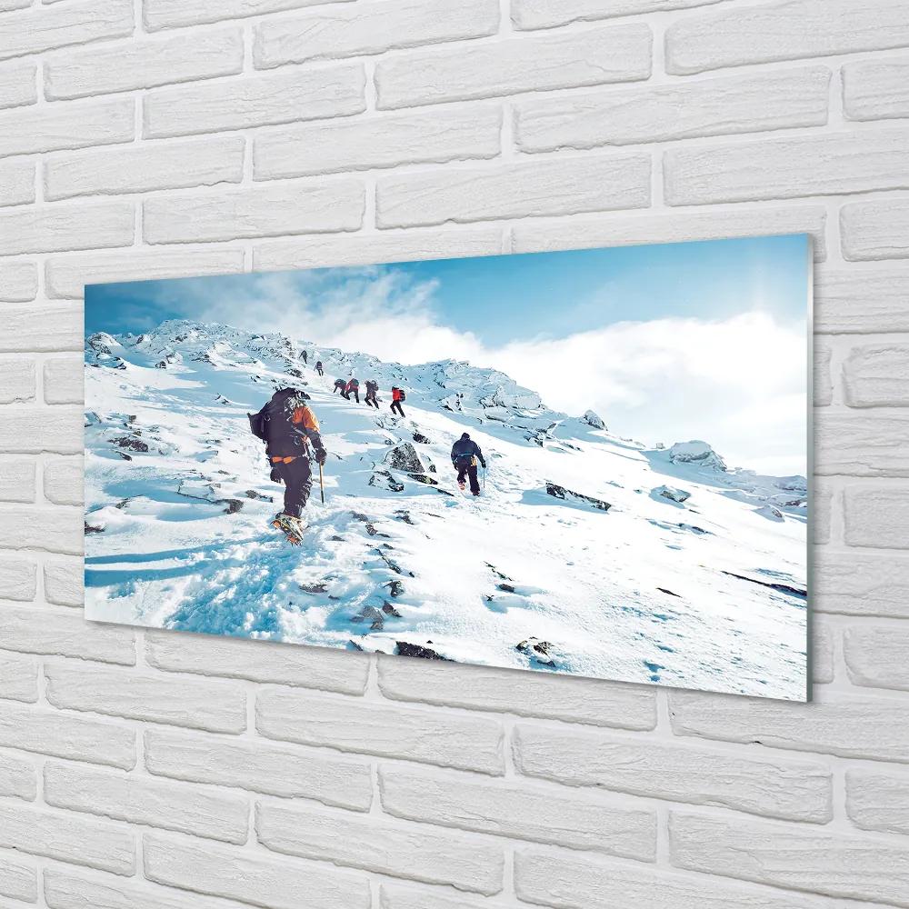 Obraz plexi Lezenie na hory v zime 100x50 cm